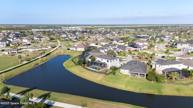 bird's eye view with a residential view and a water view
