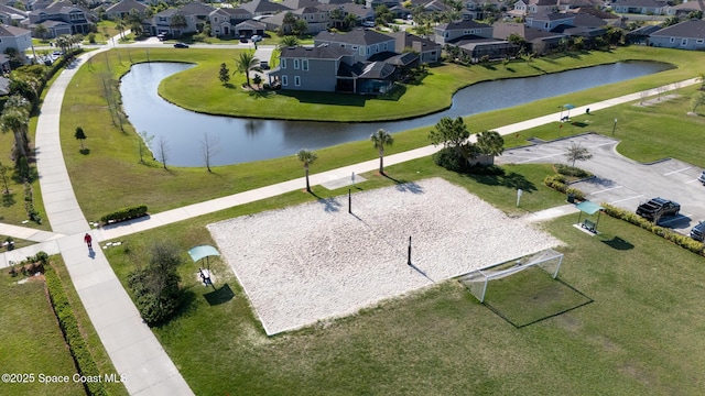 birds eye view of property with a residential view and a water view