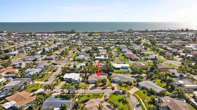 drone / aerial view featuring a water view and a residential view