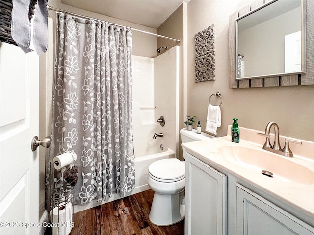 full bathroom featuring hardwood / wood-style flooring, vanity, toilet, and shower / bathtub combination with curtain