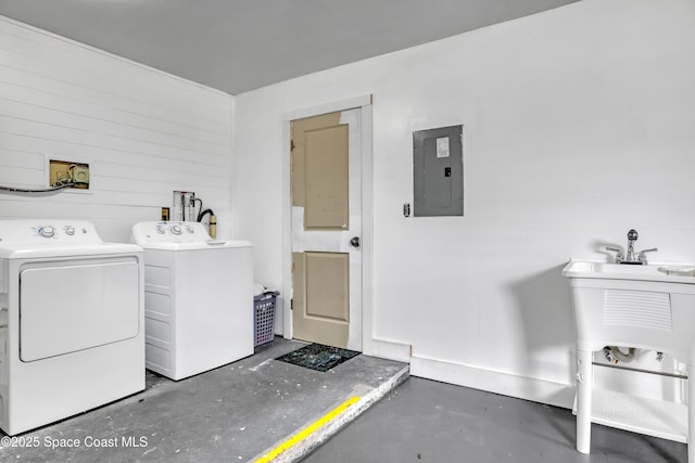 clothes washing area with laundry area, separate washer and dryer, and electric panel