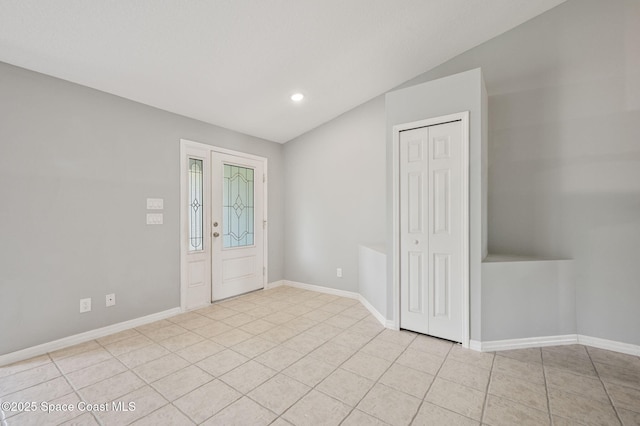 entrance foyer featuring recessed lighting, baseboards, and light tile patterned floors