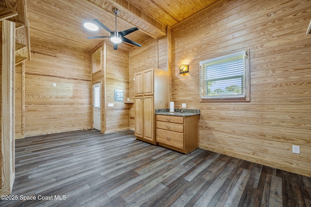 bathroom featuring a ceiling fan, wood finished floors, vanity, wooden walls, and wood ceiling