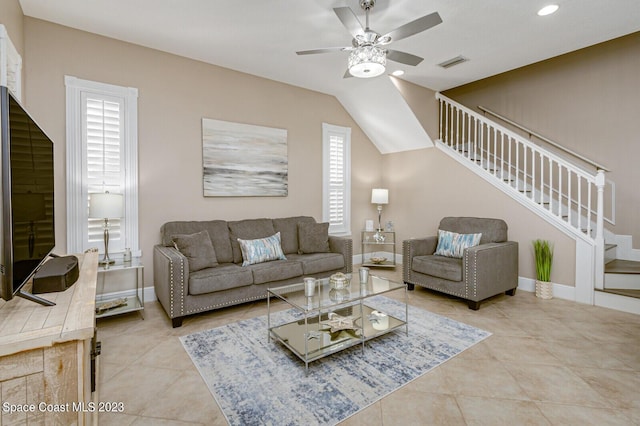 living room featuring ceiling fan and light tile patterned flooring