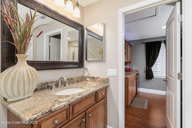 bathroom with hardwood / wood-style flooring and vanity