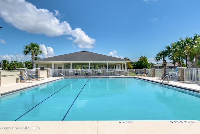 view of swimming pool with a patio