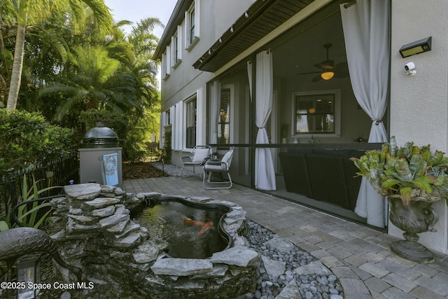 view of patio / terrace featuring ceiling fan