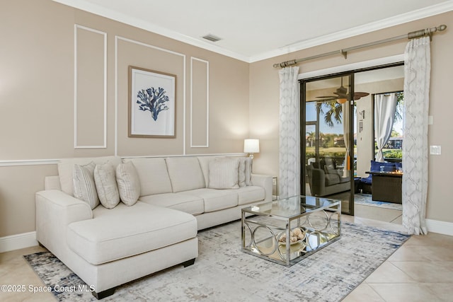 tiled living room featuring crown molding and ceiling fan