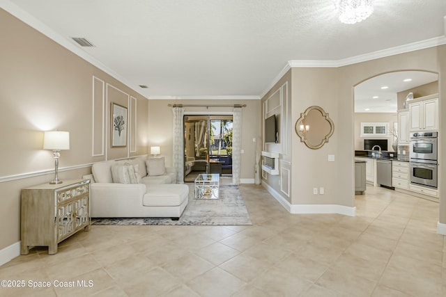 tiled living room with ornamental molding