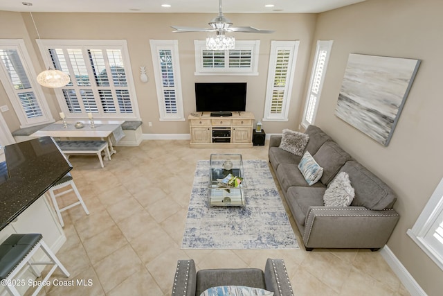 tiled living room featuring ceiling fan