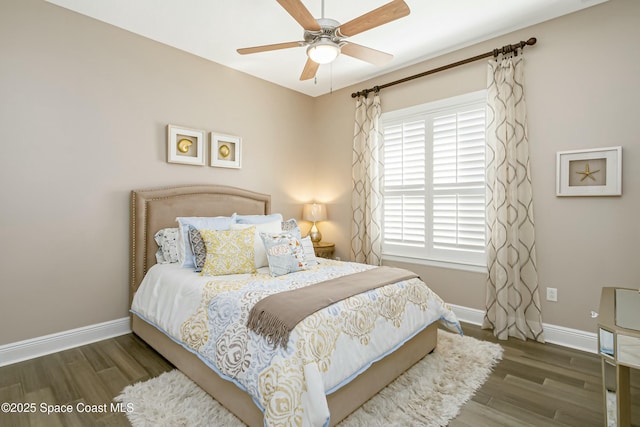 bedroom with dark wood-type flooring and ceiling fan