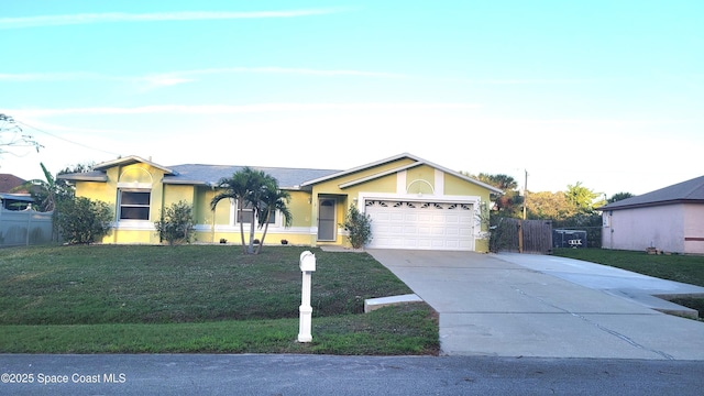 single story home with a front lawn and a garage