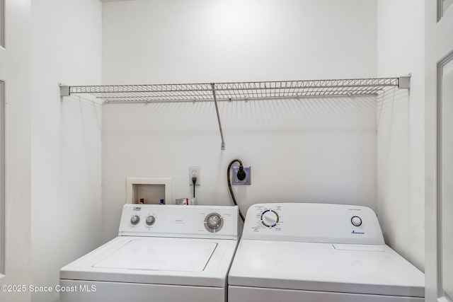 laundry area with washing machine and dryer