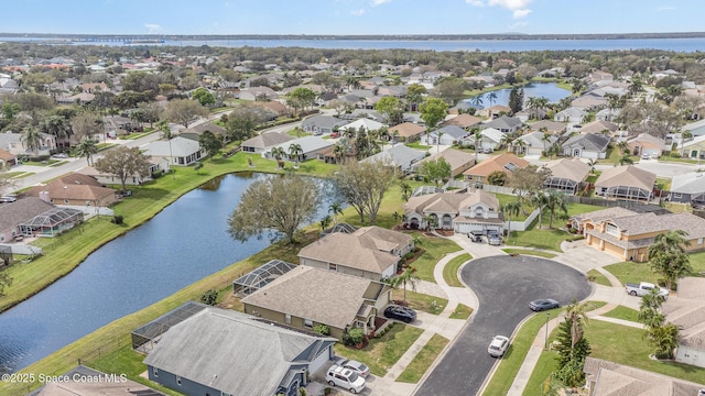 birds eye view of property with a residential view and a water view