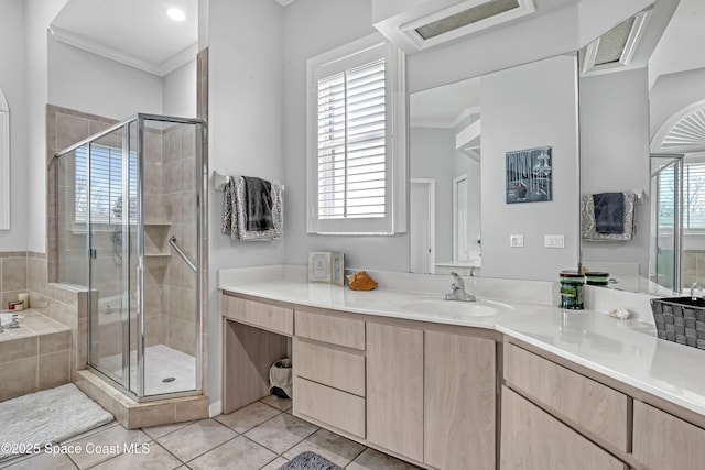 full bath featuring a stall shower, tile patterned floors, crown molding, vanity, and tiled tub