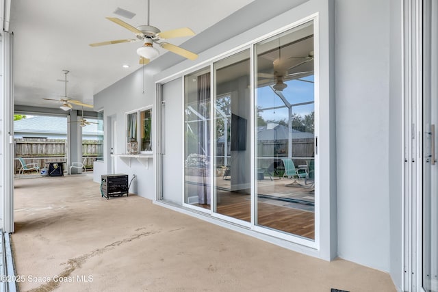 view of patio / terrace with a ceiling fan, a lanai, and visible vents