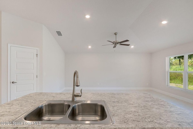 kitchen with lofted ceiling, sink, and ceiling fan