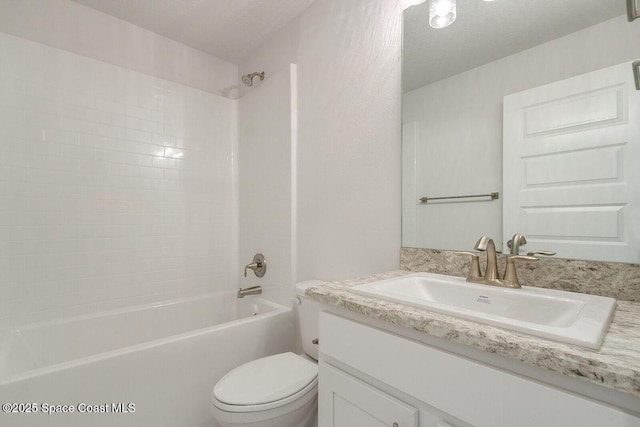 full bathroom featuring shower / washtub combination, toilet, and vanity