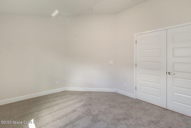 unfurnished room featuring carpet flooring