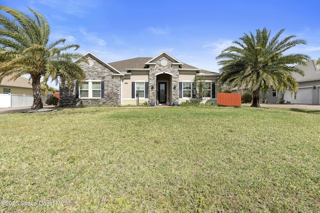 view of front of property with a garage and a front lawn