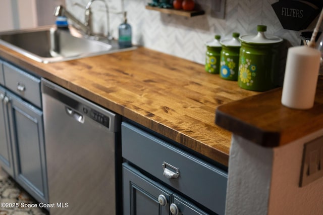 kitchen with a sink, wooden counters, stainless steel dishwasher, and gray cabinets