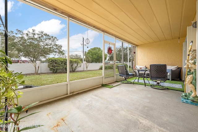 unfurnished sunroom featuring plenty of natural light