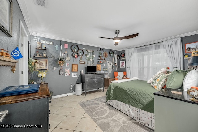 bedroom with light tile patterned floors, a ceiling fan, visible vents, baseboards, and ornamental molding