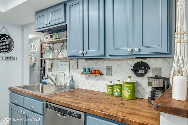 kitchen with dishwasher, a sink, and blue cabinets