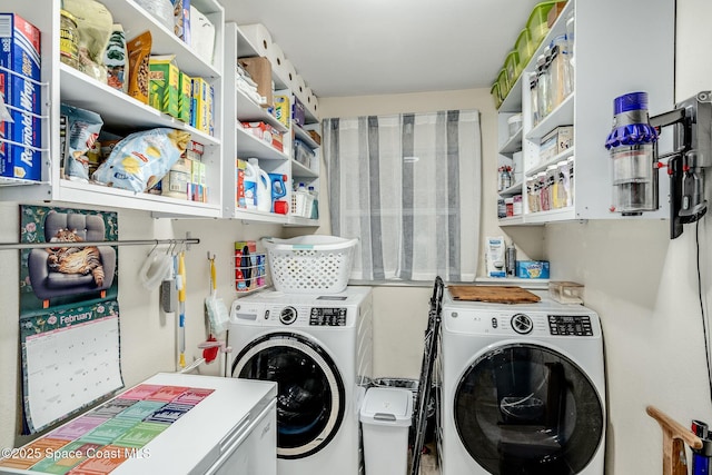 laundry area with laundry area and separate washer and dryer