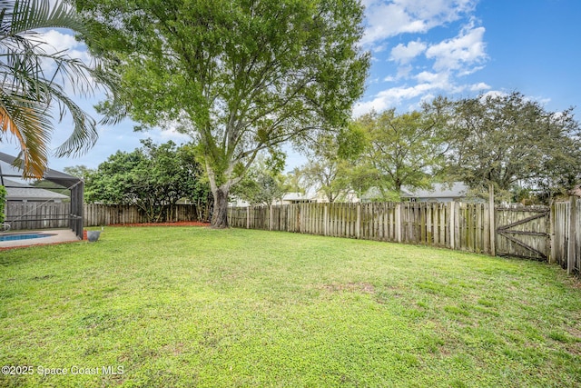 view of yard with a fenced in pool and a fenced backyard