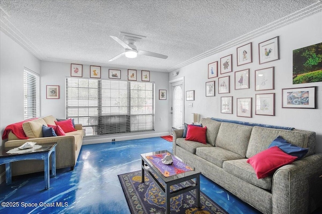 living room featuring concrete flooring, ceiling fan, crown molding, and a textured ceiling