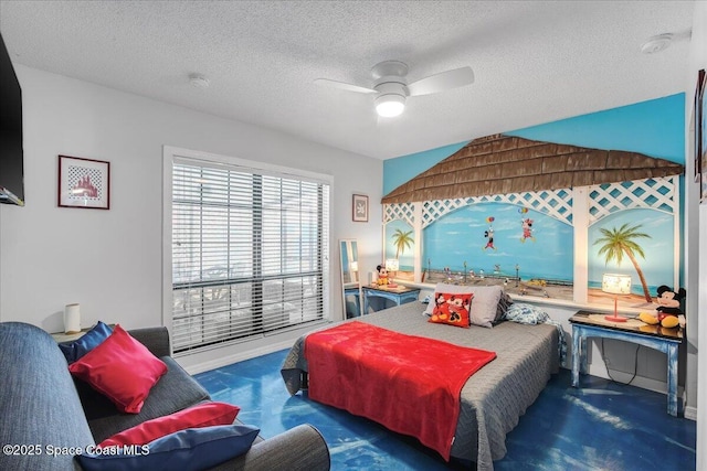 bedroom with ceiling fan and a textured ceiling