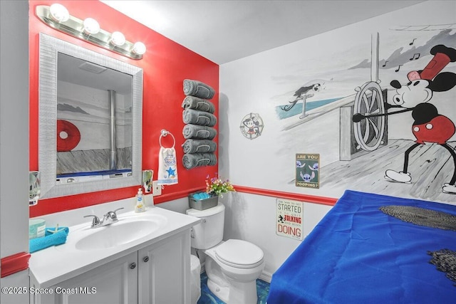 bathroom with vanity and toilet