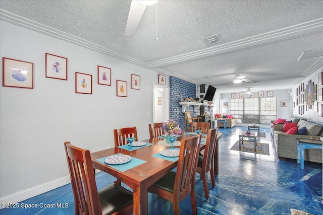 dining space featuring a textured ceiling, a fireplace, and ceiling fan