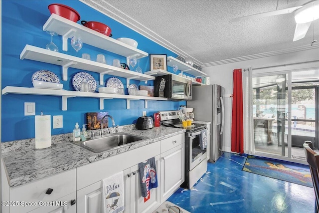 kitchen with white cabinetry, sink, stainless steel appliances, and a textured ceiling