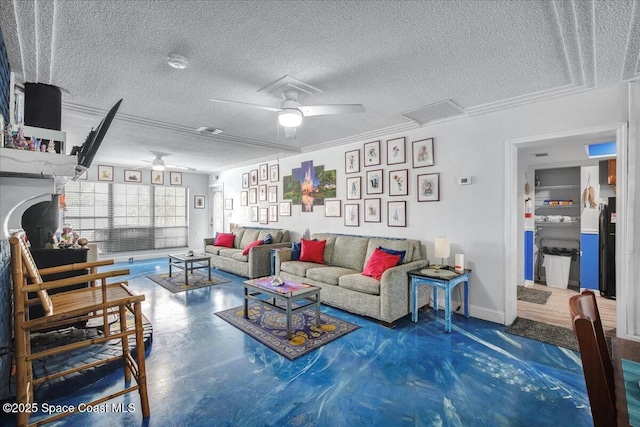 living room featuring ceiling fan and a textured ceiling