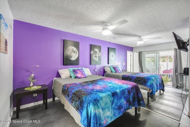 bedroom featuring ceiling fan, access to outside, and a textured ceiling