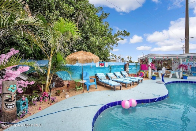 view of swimming pool featuring a patio area