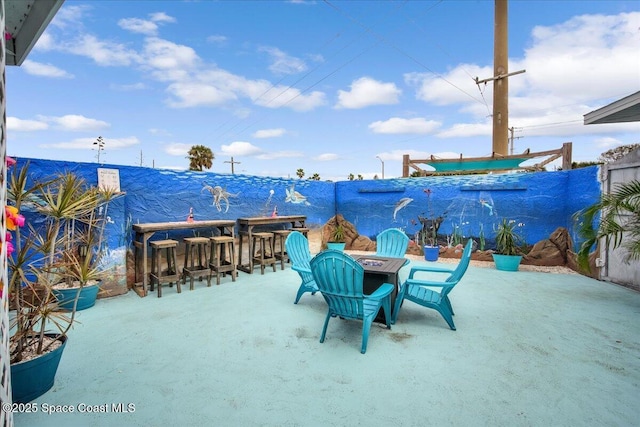 view of patio with an outdoor bar