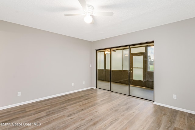 2145 Golf Isle Dr Unit 1212, Melbourne, FL 32935 - unfurnished bedroom with ceiling fan, a closet, hardwood / wood-style floors, and a textured ceiling