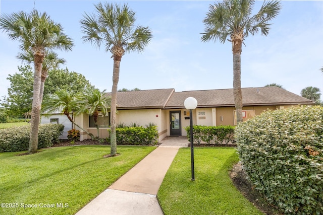 2145 Golf Isle Dr Unit 1212, Melbourne, FL 32935 - view of front of home with a front lawn
