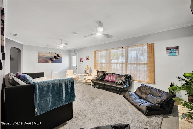 carpeted living room featuring ceiling fan