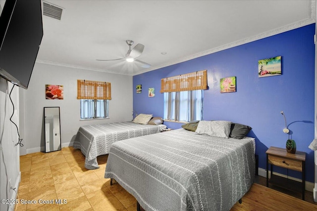 bedroom featuring ornamental molding and ceiling fan