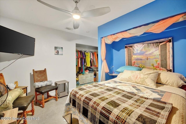 bedroom with light colored carpet, a closet, and ceiling fan