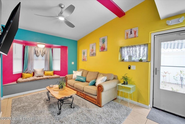 tiled living room with lofted ceiling and ceiling fan