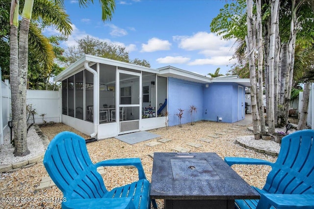 back of property featuring a sunroom