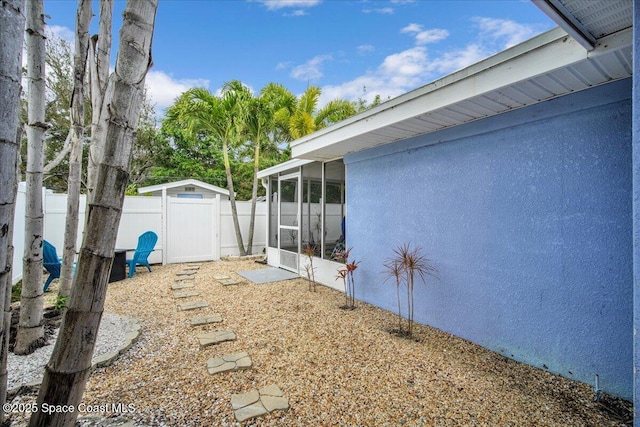 view of yard featuring a sunroom