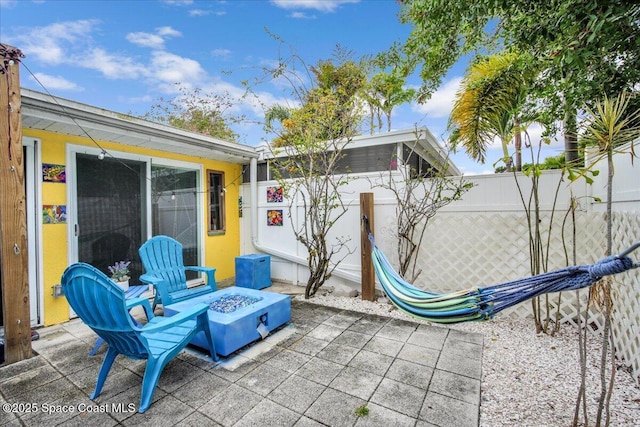 view of patio / terrace with an outdoor fire pit