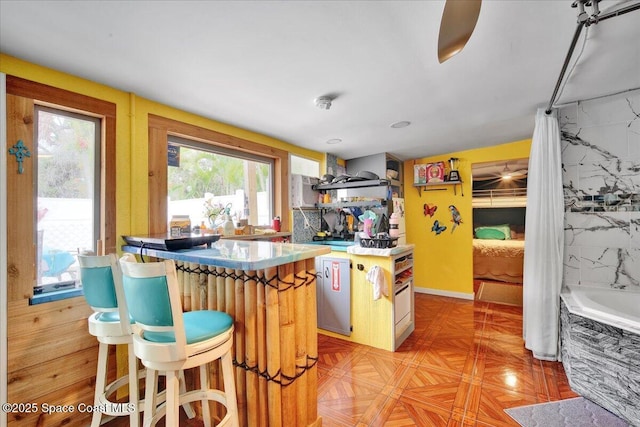 kitchen with a center island and light parquet flooring