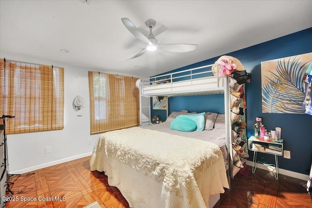 bedroom with parquet floors and ceiling fan